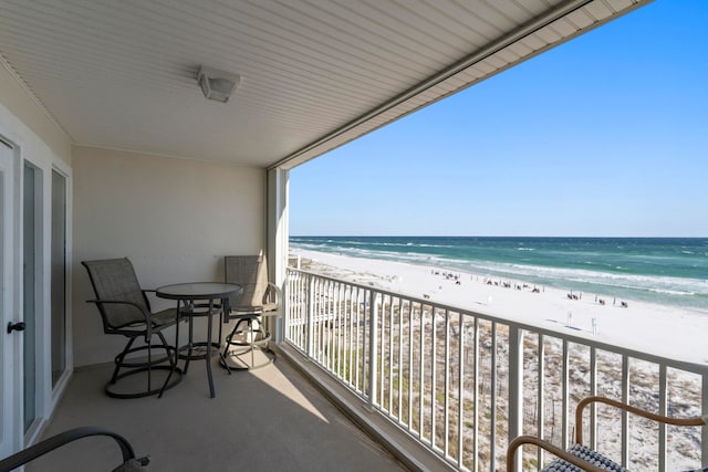 balcony with a beach view and a water view