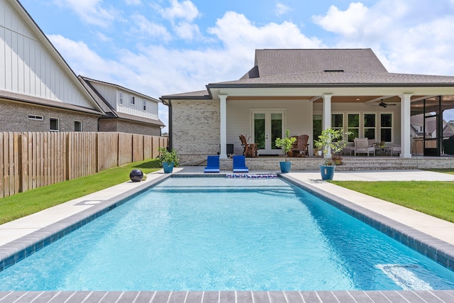 view of pool featuring a patio, ceiling fan, and french doors