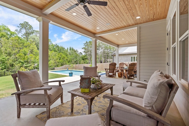 view of patio / terrace featuring outdoor lounge area, ceiling fan, and a fenced in pool