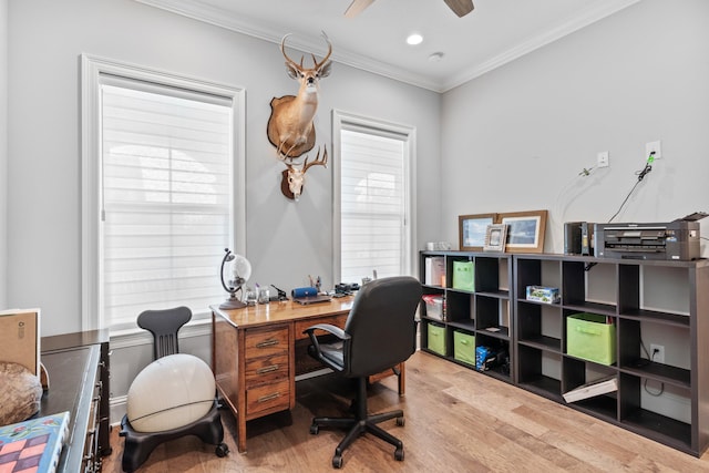 home office featuring crown molding, wood-type flooring, and ceiling fan