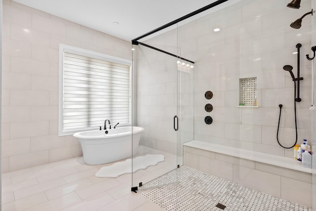 bathroom featuring tile walls, independent shower and bath, and tile floors