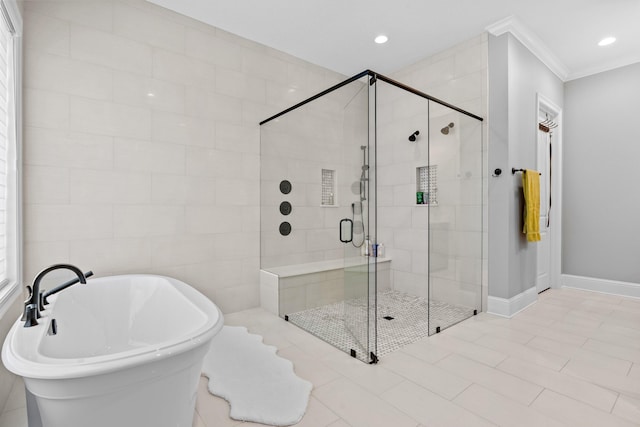 bathroom featuring tile walls, crown molding, tile flooring, and independent shower and bath