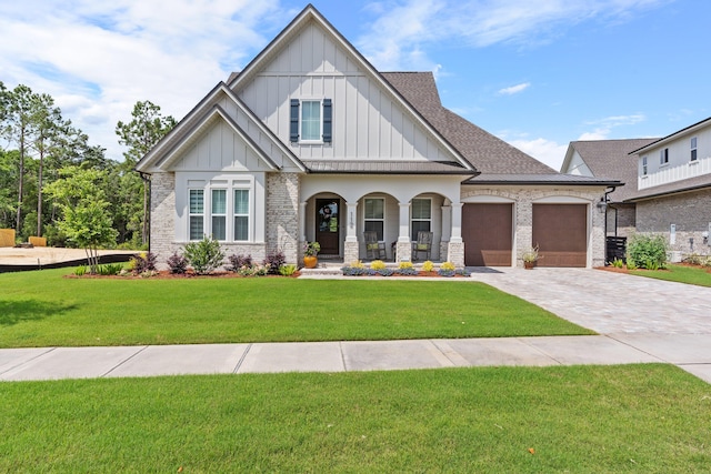 view of front facade with a garage and a front lawn