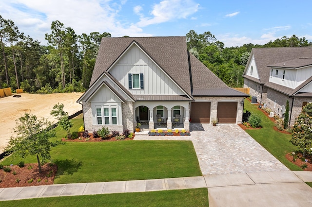 view of front of house featuring a garage and a front yard