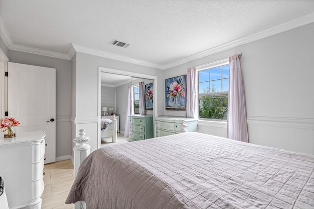 bedroom with a closet, crown molding, light tile flooring, and a textured ceiling