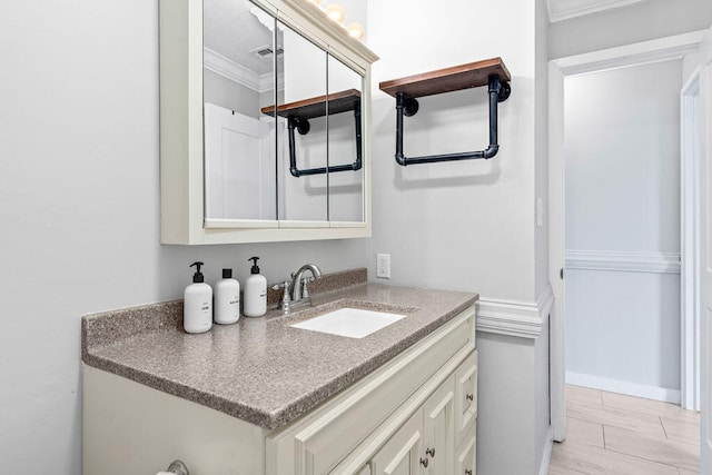 bathroom with vanity, tile floors, and ornamental molding