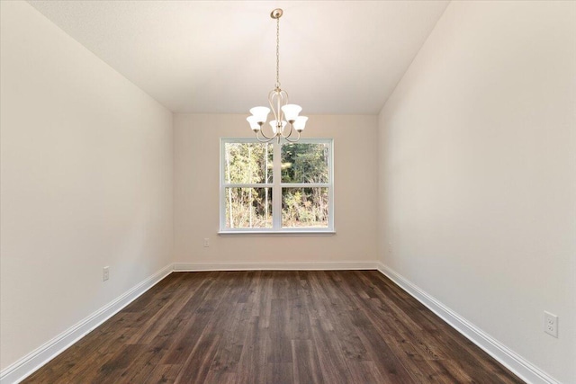 interior space with a notable chandelier and dark hardwood / wood-style floors