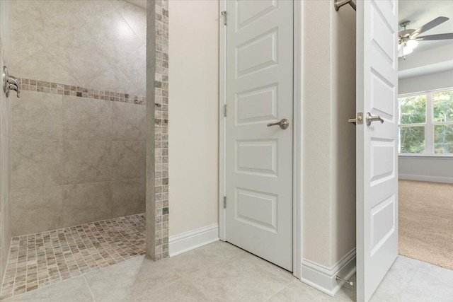 bathroom with tiled shower, tile patterned floors, and ceiling fan