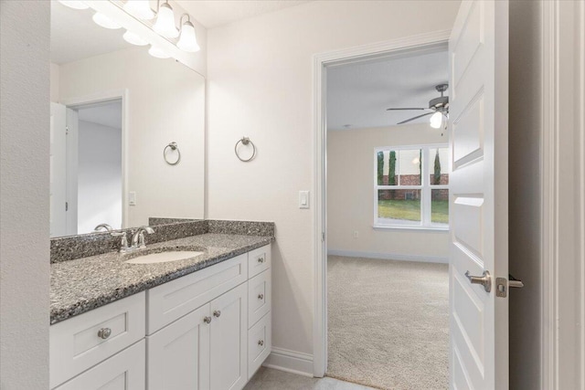 bathroom featuring ceiling fan and vanity