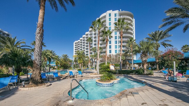 community pool with a patio