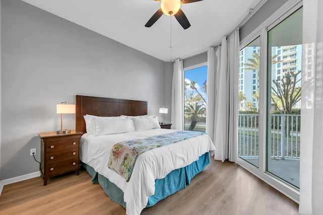 bedroom with baseboards, ceiling fan, light wood finished floors, and access to exterior