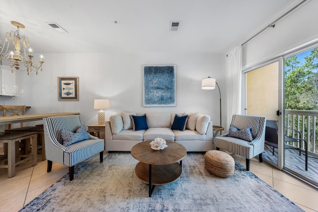 tiled living room with an inviting chandelier