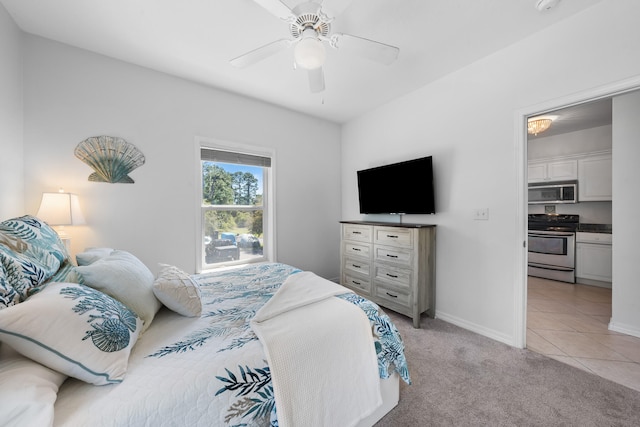 tiled bedroom featuring ceiling fan