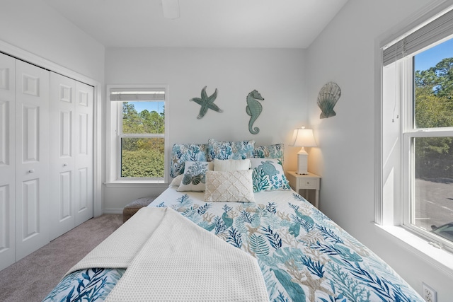 bedroom featuring a closet, carpet floors, and ceiling fan