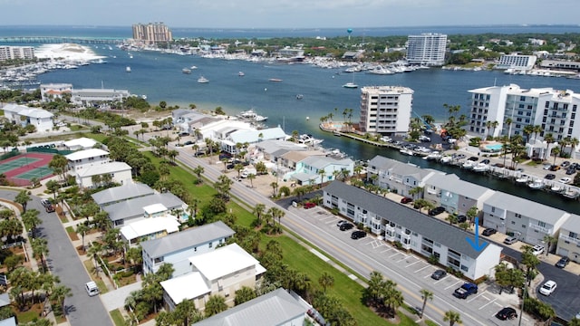 birds eye view of property with a water view and a city view