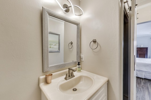 ensuite bathroom featuring ensuite bathroom and vanity