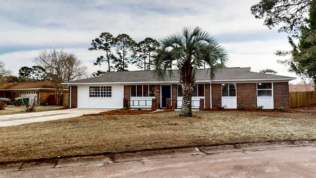 ranch-style home featuring a garage and a porch