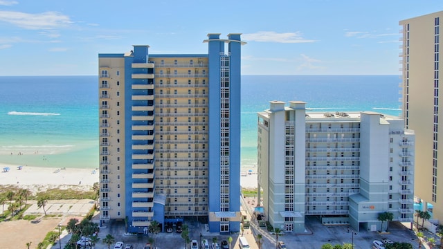 exterior space featuring a beach view and a water view