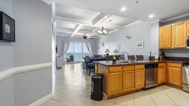 kitchen with kitchen peninsula, appliances with stainless steel finishes, sink, coffered ceiling, and dark stone counters