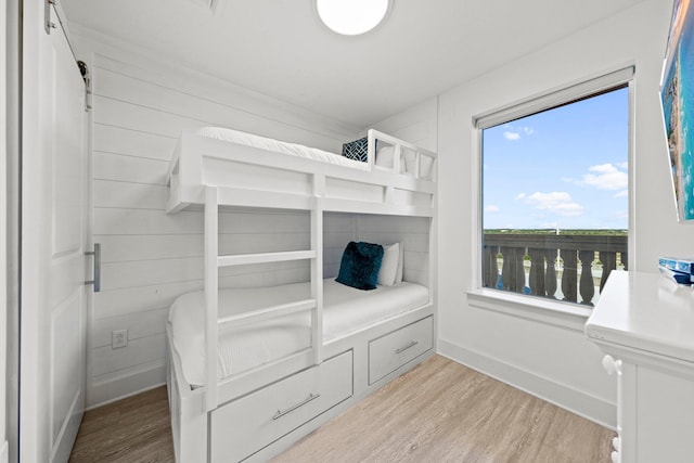 bedroom with light hardwood / wood-style floors