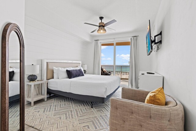 bedroom featuring ceiling fan and access to outside