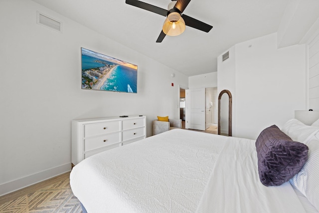 bedroom with ceiling fan and light parquet flooring