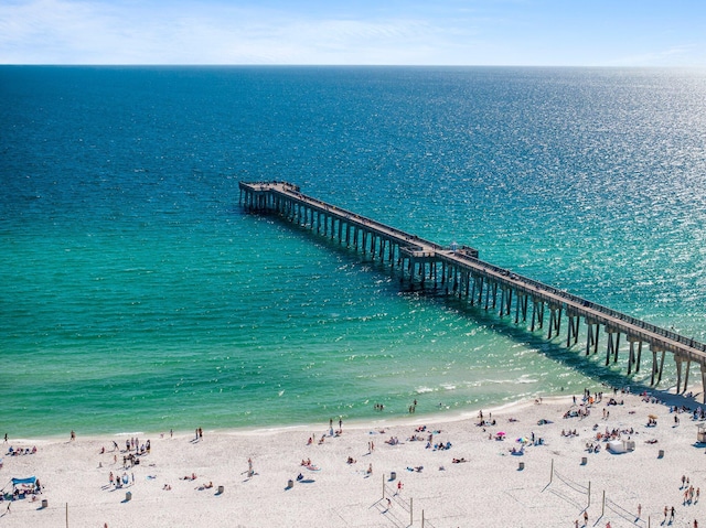 dock area featuring a water view and a beach view