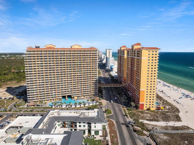 drone / aerial view with a water view and a view of the beach