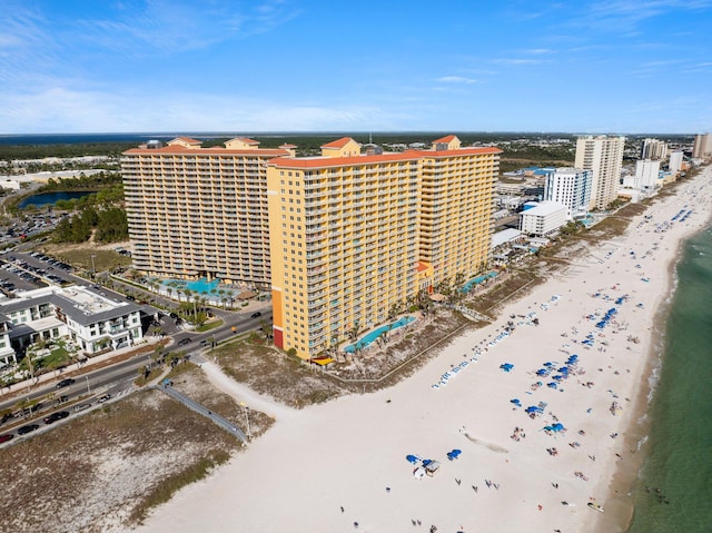 bird's eye view featuring a view of the beach and a water view