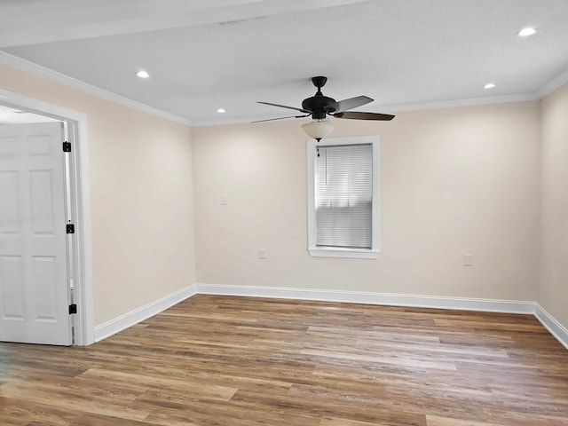 empty room with ceiling fan, light hardwood / wood-style flooring, and ornamental molding