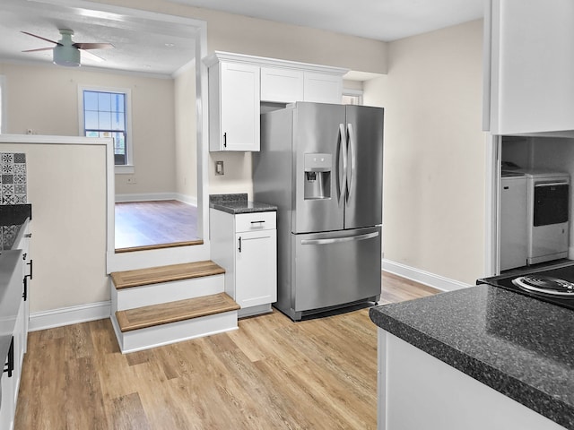 kitchen featuring ceiling fan, light wood-type flooring, white cabinets, and stainless steel fridge