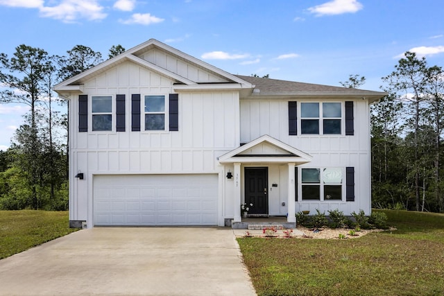 view of front of home with a garage and a front yard