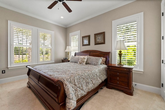 bedroom featuring light colored carpet, ceiling fan, and ornamental molding