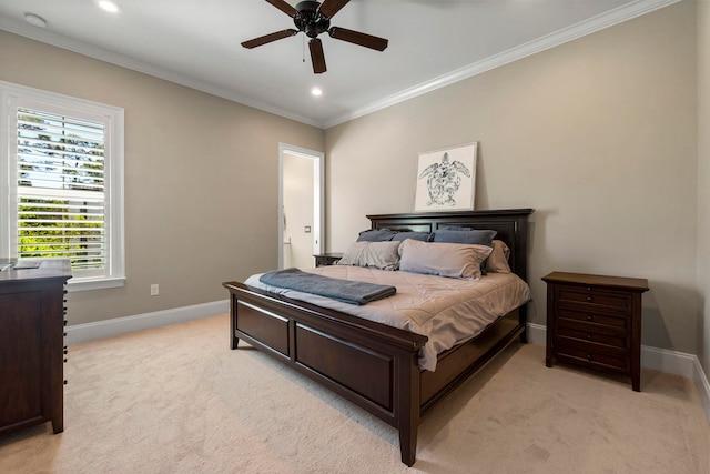 carpeted bedroom with crown molding and ceiling fan