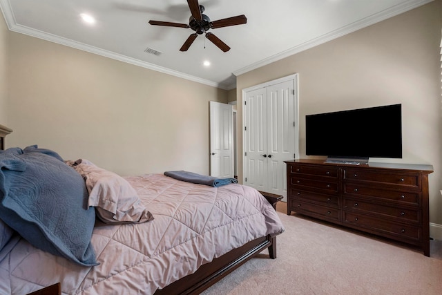 bedroom featuring ceiling fan, light carpet, and ornamental molding