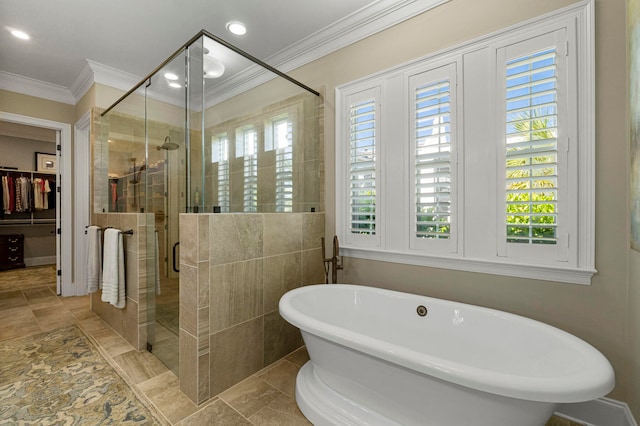 bathroom with ornamental molding, independent shower and bath, and tile floors