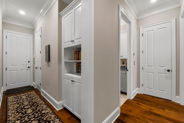 hall with ornamental molding and dark hardwood / wood-style flooring