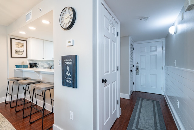 hallway featuring dark hardwood / wood-style flooring