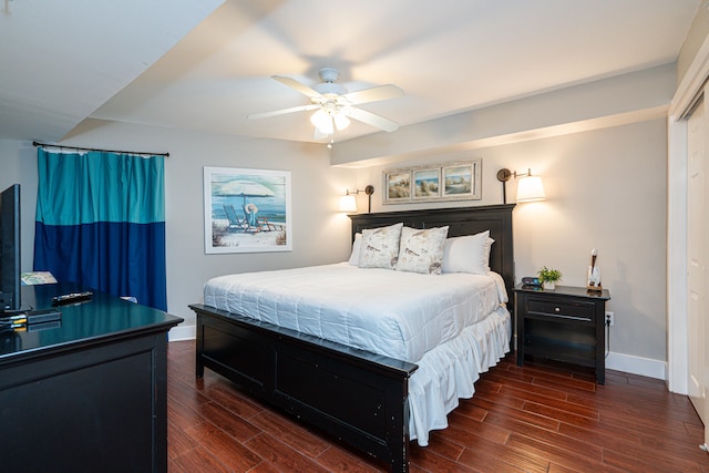 bedroom with ceiling fan and dark hardwood / wood-style flooring