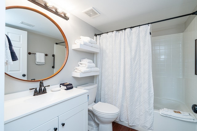 full bathroom with vanity, shower / bath combination with curtain, and toilet