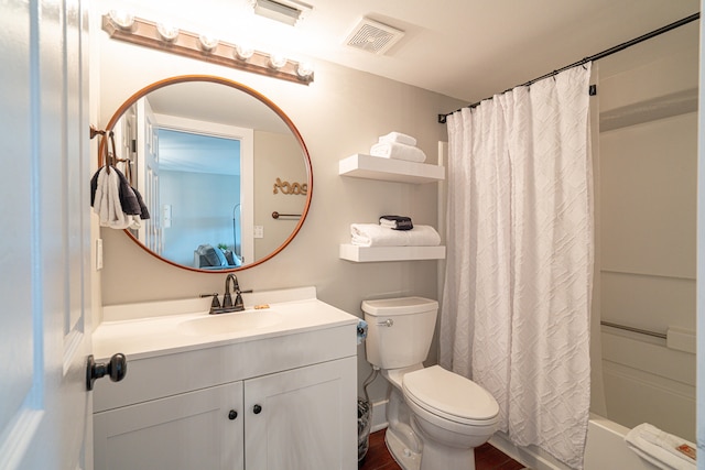 full bathroom with shower / bath combo, toilet, and large vanity