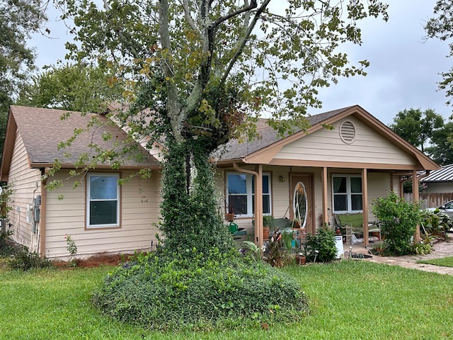 view of front of property with a porch and a front yard