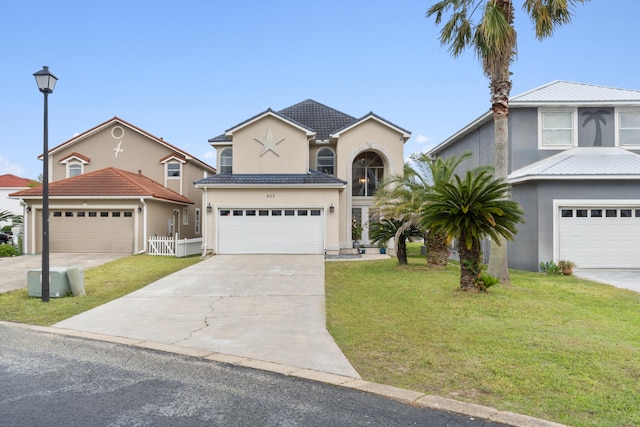 view of front facade with a garage and a front yard