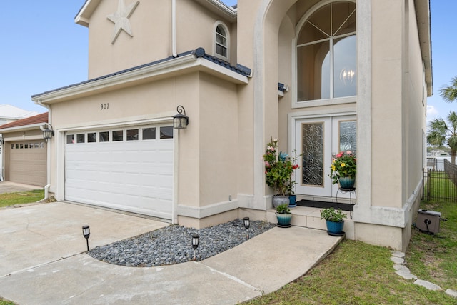 view of exterior entry featuring a garage