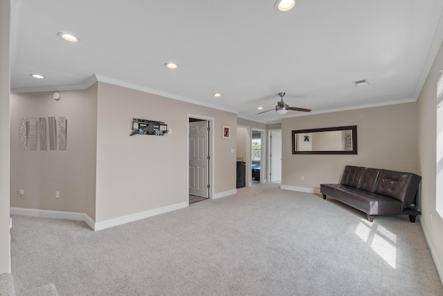 unfurnished room with light colored carpet, ceiling fan, and crown molding