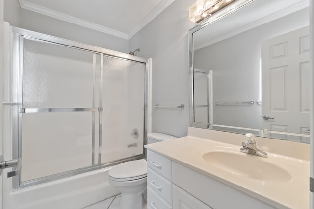 full bathroom with large vanity, enclosed tub / shower combo, tile floors, toilet, and ornamental molding