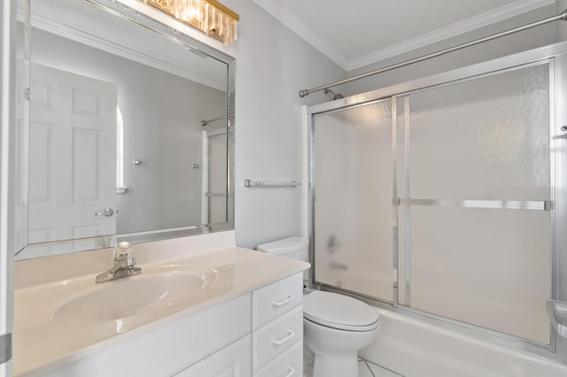 full bathroom with tile flooring, vanity with extensive cabinet space, toilet, ornamental molding, and shower / bath combination with glass door