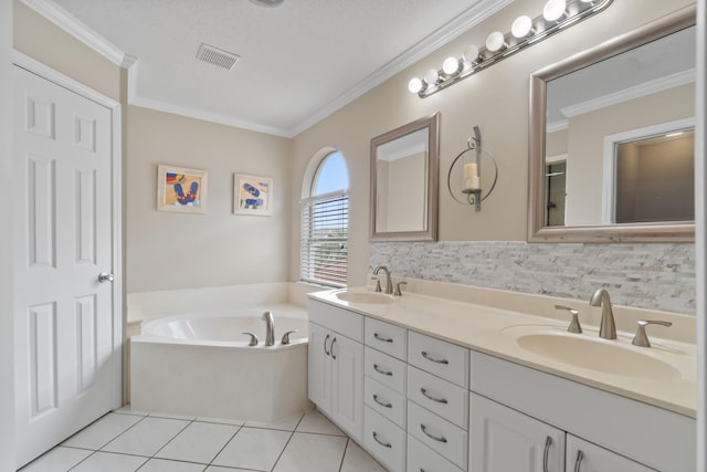 bathroom featuring a bathtub, tile flooring, double sink vanity, tasteful backsplash, and a textured ceiling