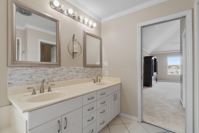 bathroom featuring crown molding, tile floors, backsplash, double sink vanity, and a textured ceiling