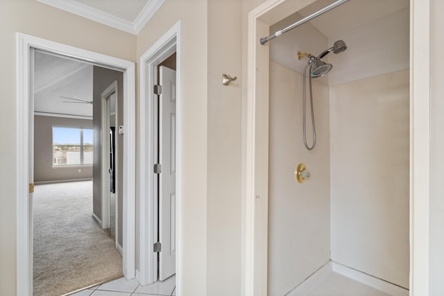 bathroom featuring crown molding and tile flooring